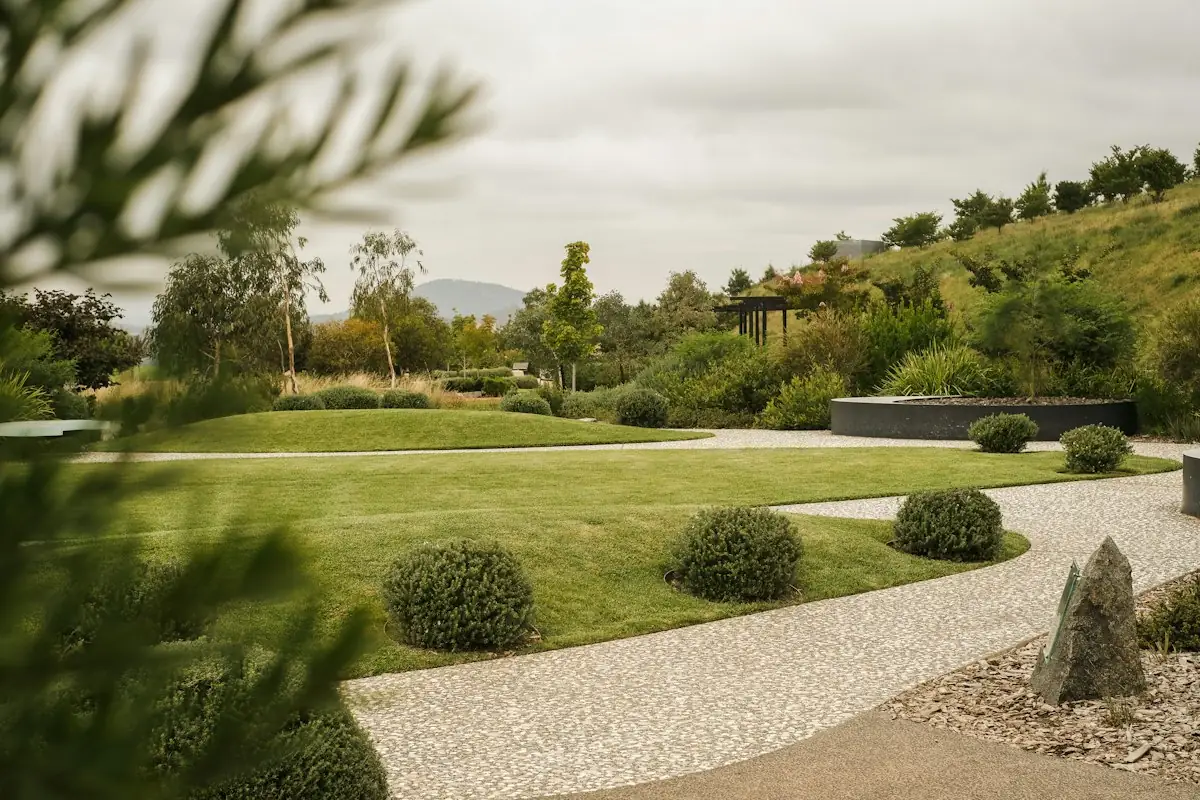 A stone paved path and planted border in a village garden near Winchester